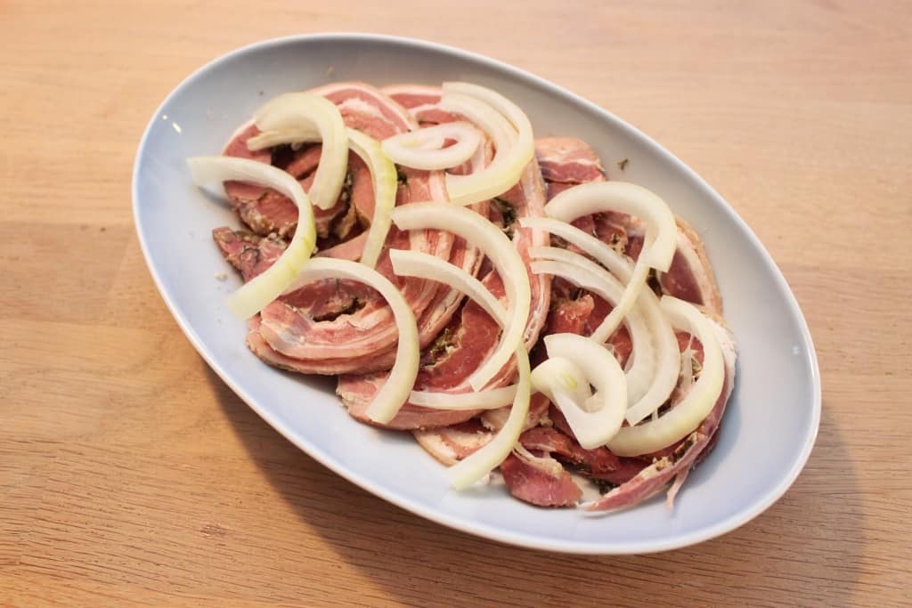Rolled ham sausage with onions